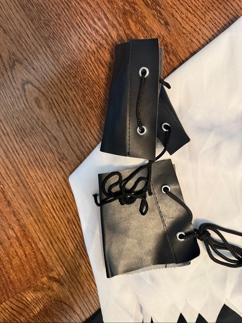 Size M/8-10 pirate costume. Shirt, Pants, Belt, Boot Covers, Scarf, wrist cuffs.